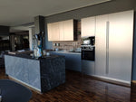 Cucina design con penisola "Kali" By Arredo3 in Noce Imperial e PET INOX