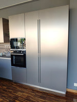 Cucina design con penisola "Kali" By Arredo3 in Noce Imperial e PET INOX